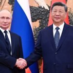 Xi verwelkomt 'oude vriend' Poetin die 'ongekende' banden in Beijing prijst